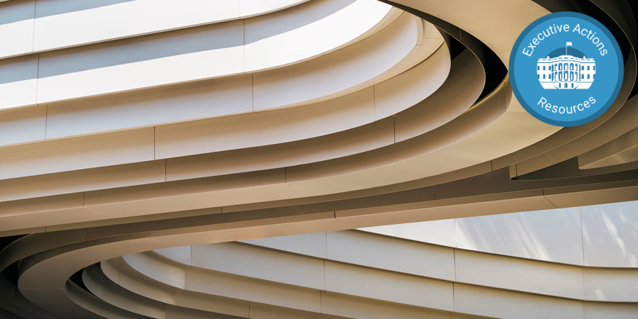 Close up of higher education building architecture with Executive Actions Resources badge in top right corner