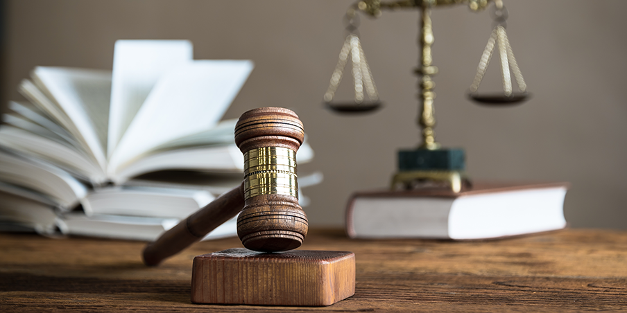 gavel with books and weights